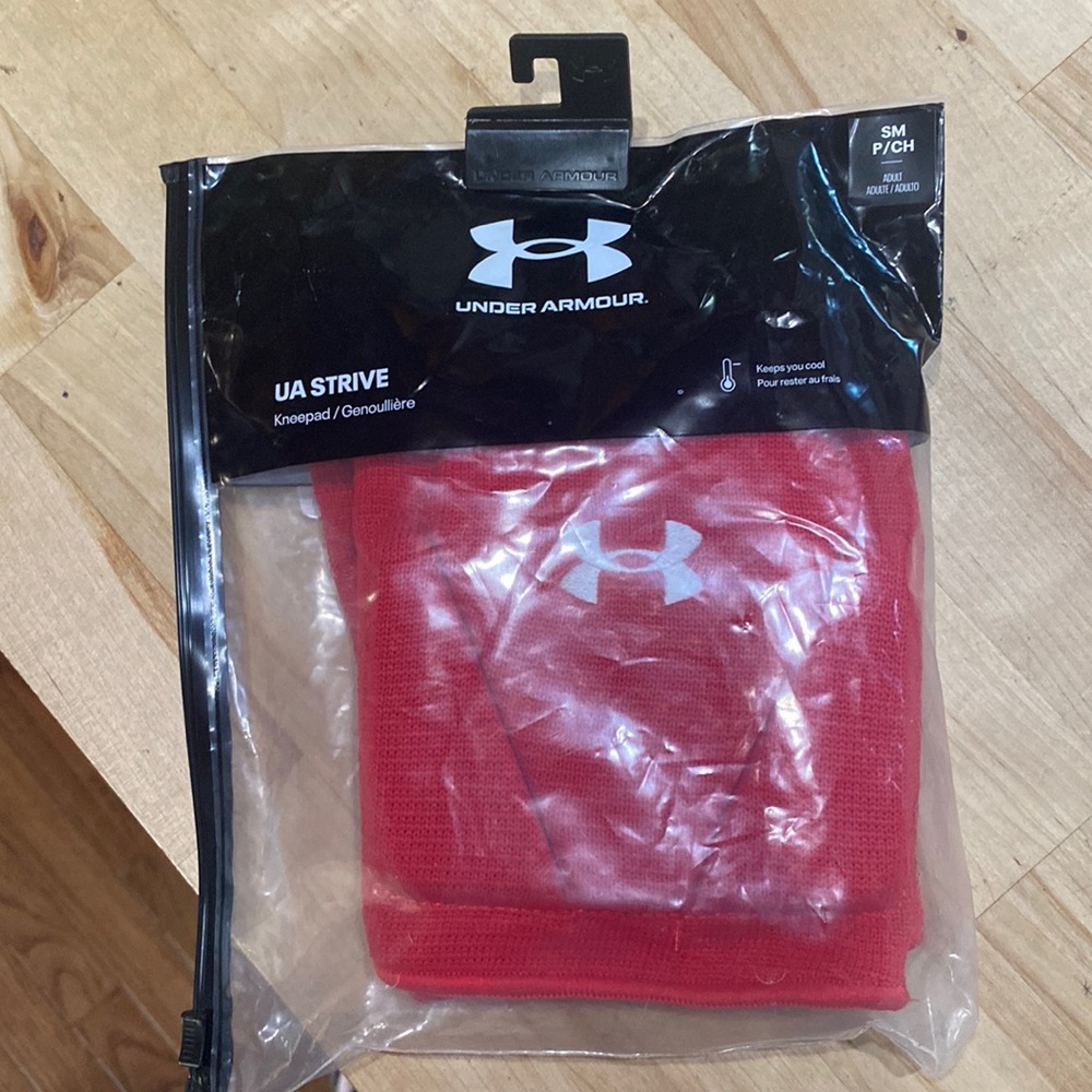 Brand new under Armour knee pads adult small